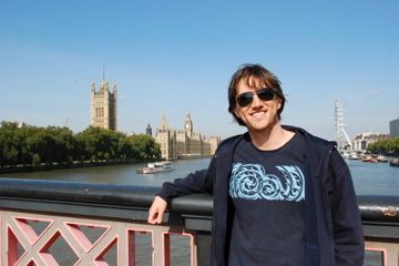 Curtis in front of the London Eye and Big Ben